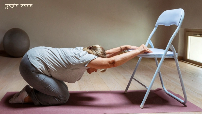 Chair yoga for seniors. A lady practicing yoga with the help of a chair. Blog by yogiczone.com