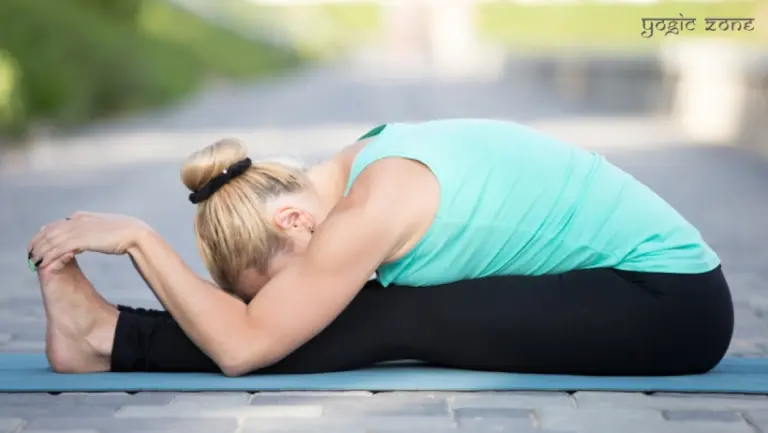 A lady performing the Paschimottanasana. Yoga for stress relief by yogiczone.com