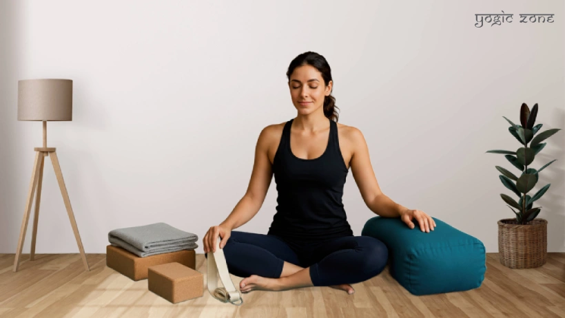 yogini surrounded by yoga props for beginners. Blog by yogiczone.com